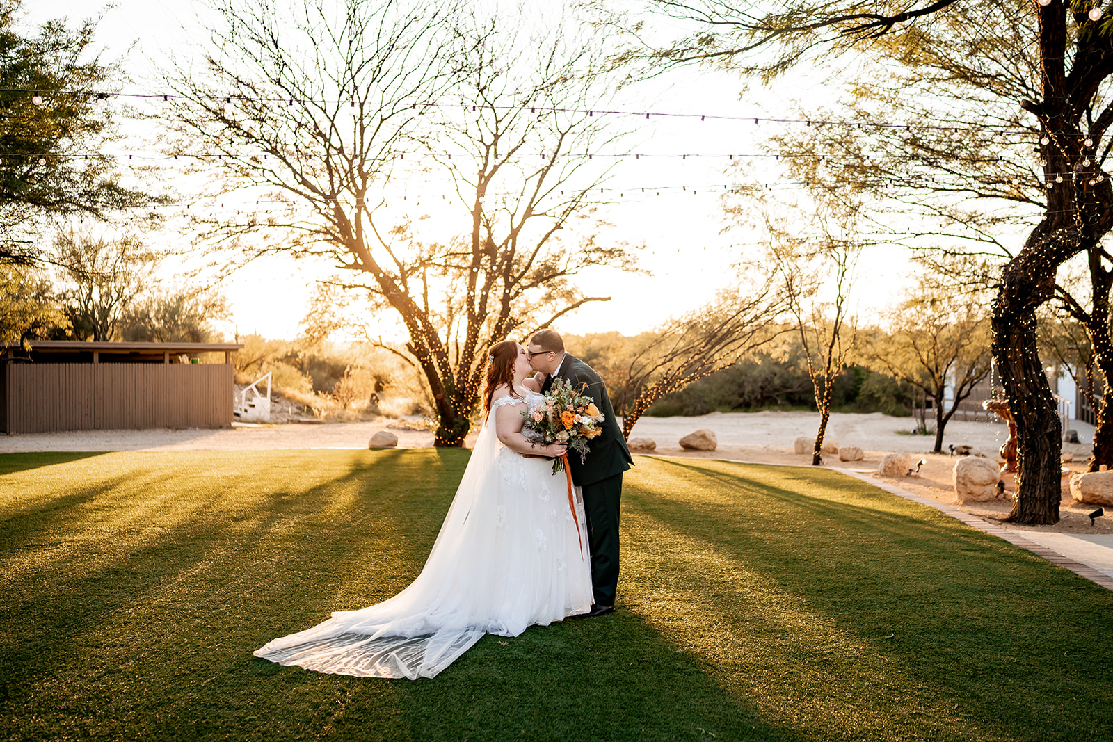 bride and groom posing for wedding photo at Saguaro Buttes wedding venue